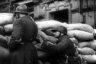 A photo of soldiers behind a barricade