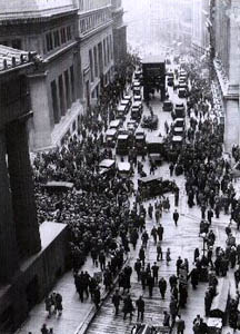 A black and white photo of people gathering on Wall Street